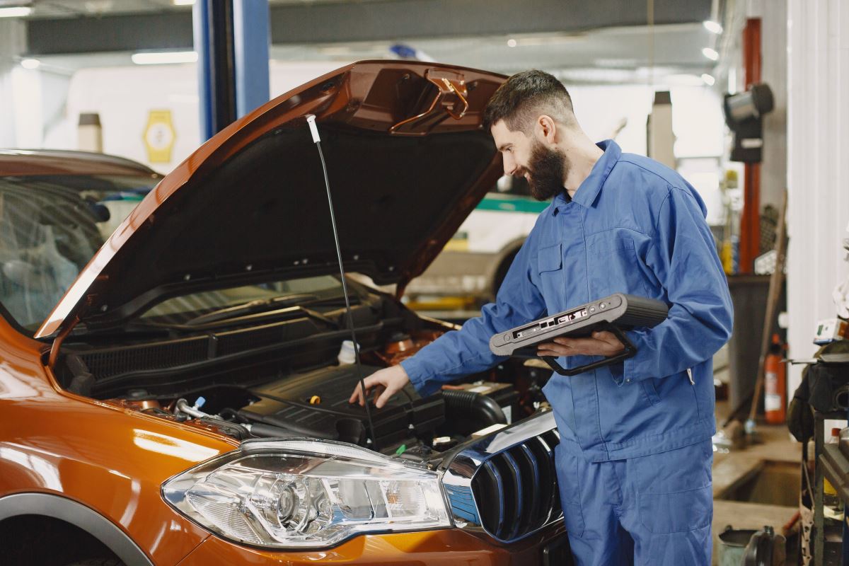 Morrow - mechanic servicing a vehicle
